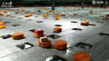 Image of The little orange robots can sort 200,000 parcels per day, faster and with greater accuracy than humans. 