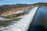 Image of Water breaches the spillway at Oroville Dam on Feb. 12.
