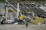 Image of Winds have combined with floods to destroy the island. Recovery will take months to years. 