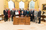 Image of The President's Cabinet in March, shortly after it was initially formed. At the time of this image, four seats remained unfilled. 