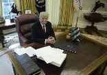 Image of President Trump signed the tax cut bill early as a Christmas present for the American people. 