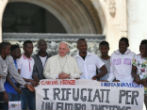 Image of Pope Francis with refugees. 
