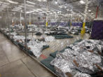 Image of Children are being held in detention centers like this former converted Wal Mart. Children are held while their parents are prosecuted under Jeff Sessions Zero Tolerance policy. 