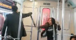 Image of An allegedly possessed woman strikes at a man attempting an exorcism on her.