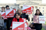 Image of Pro life campaigners gather with placards at Parliament buildings on the Stormont Estate in Belfast